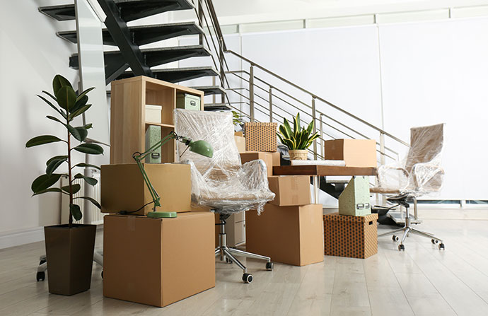 Student work desk, supplies and furniture all boxes up ready to be stored.